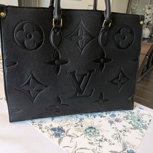 Black Leather Shoulder Handbag. Tan Suede Interior With Gold Accents.